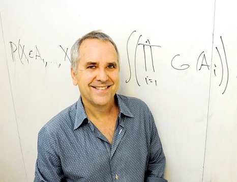 Photo of Mike Jordan in front of a whiteboard